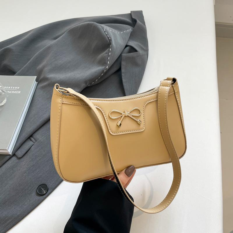 Fashion bow 2025 solid color new Korean version trendy texture foreign style commuting single shoulder underarm baguette bag women