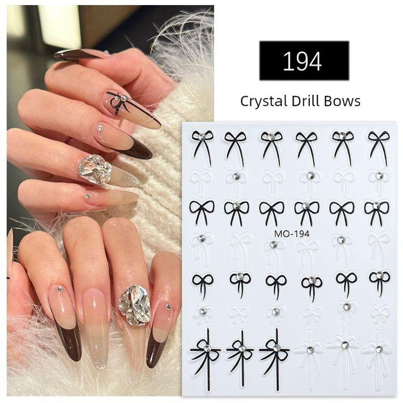 

Bright Crystal Bows Nail Art Sticker Relief Cut Out Gold and Silver Color Nail Ornament Small Accessories 2025 New Arrival MO-194 Black and White Bows [Crystal Diamond]]