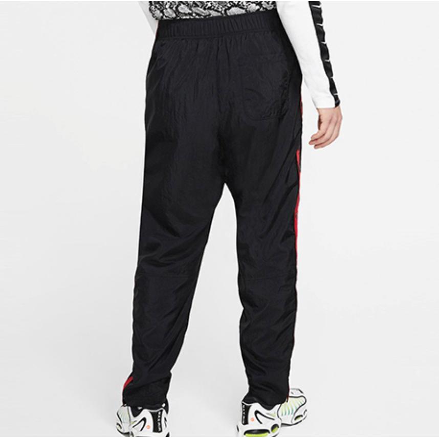 pantalon con botones laterales nike
