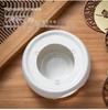 White Porcelain Tea Set with Black Ceramic Stove and Candle Base