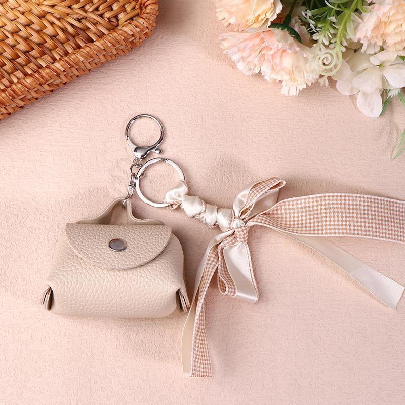 

Trendy Mini Bow Coin Bag Keychain Creative Earphone Storage Bag Pu Leather Small Coin Purses Key Pendant For Girl Gifts бежевий