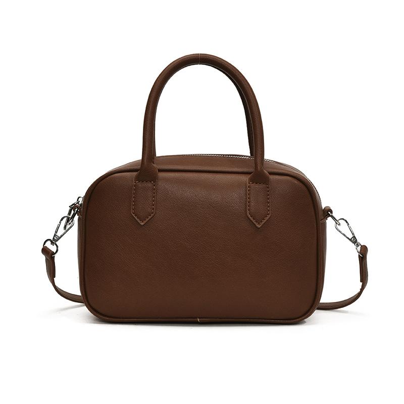 Popular fashion simple texture solid color portable Boston bag women's retro niche casual shoulder messenger bag