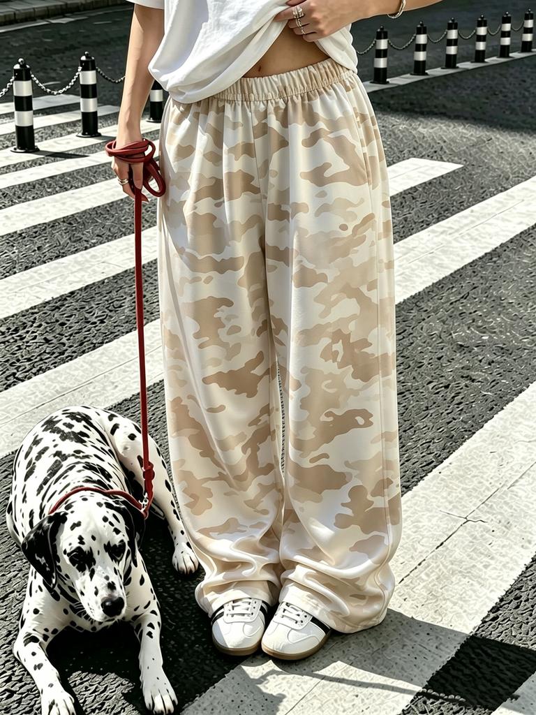 Women's plus-size wide-leg pants with stylish graffiti prints, suitable for wearing at home and for walks.