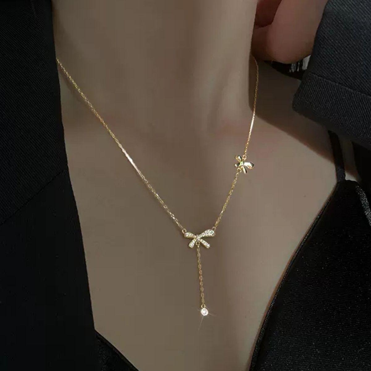

Elegant Japanese & Korean Bow Pendant Necklace: Light Luxury with Tassel for Women