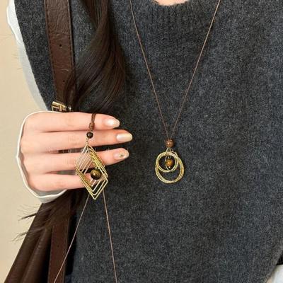 Collana vintage con pendente in pietra occhio di tigre marrone per donna, collana lunga a corda alla moda per maglione.