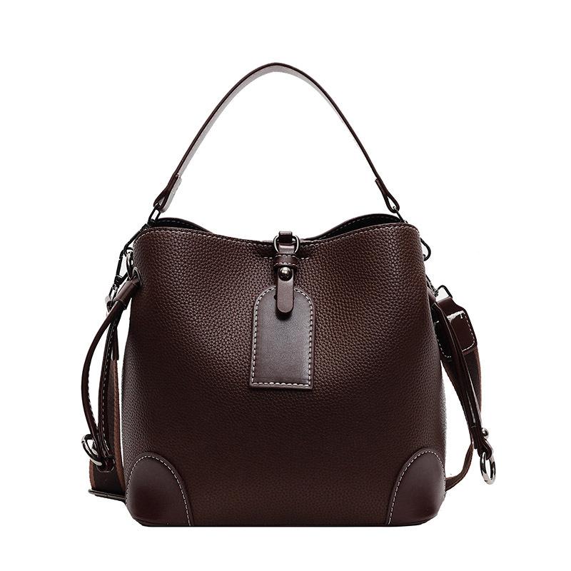 

2025 early spring new products contrasting colors, advanced texture, portable bucket bag, fashionable temperament, simple and versatile women s темно-коричневого