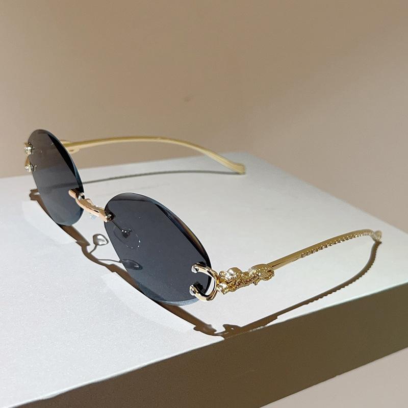 Leopard head frameless oval personalized sunglasses women s sunscreen sunglasses high-end sunglasses