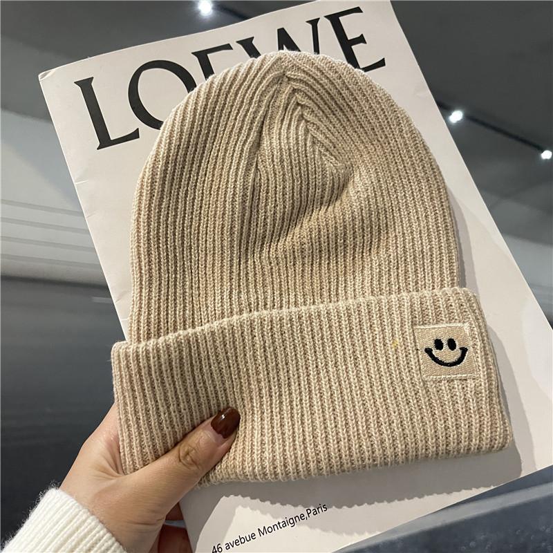 Cute smiley face label wool hat women's autumn and winter warm trend versatile ear protector black knitted hat men