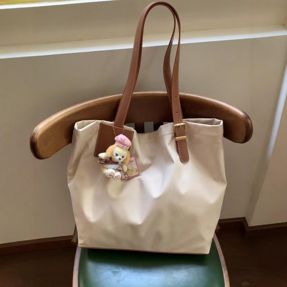 2024 Korean version of large-capacity nylon cloth bag, simple and lightweight tote bag, women's casual commuter underarm shoulder bag.
