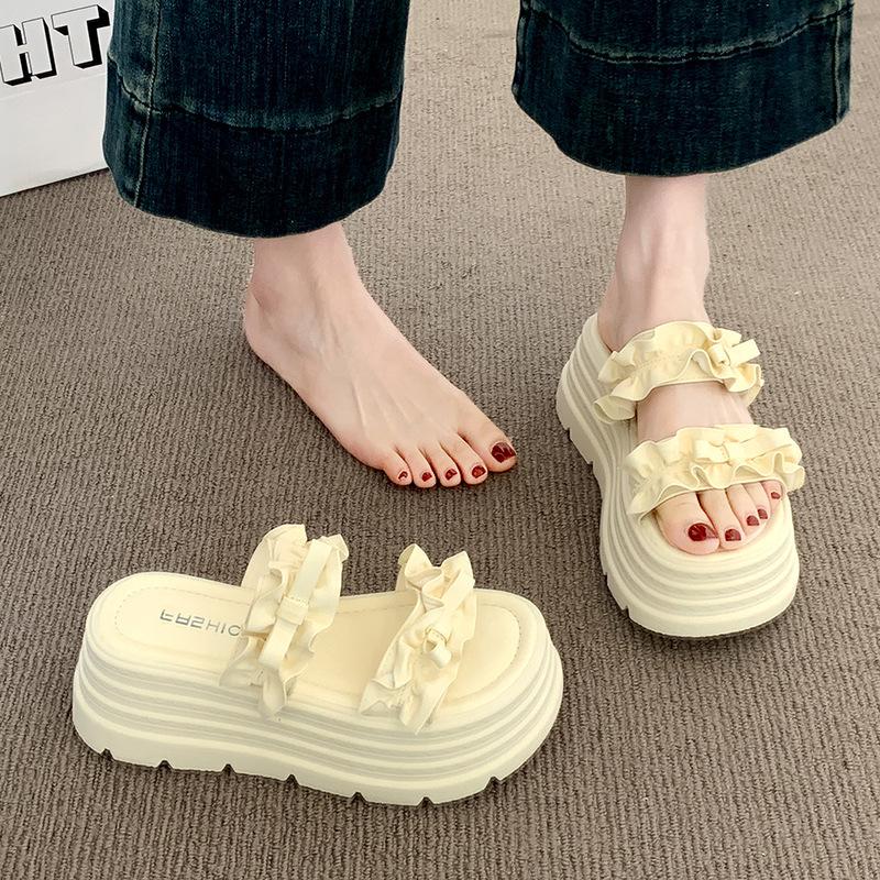 Thick-soled one-word slippers women's 2025 summer new pleated lace high-end wedge heel European goods show high outer sandals