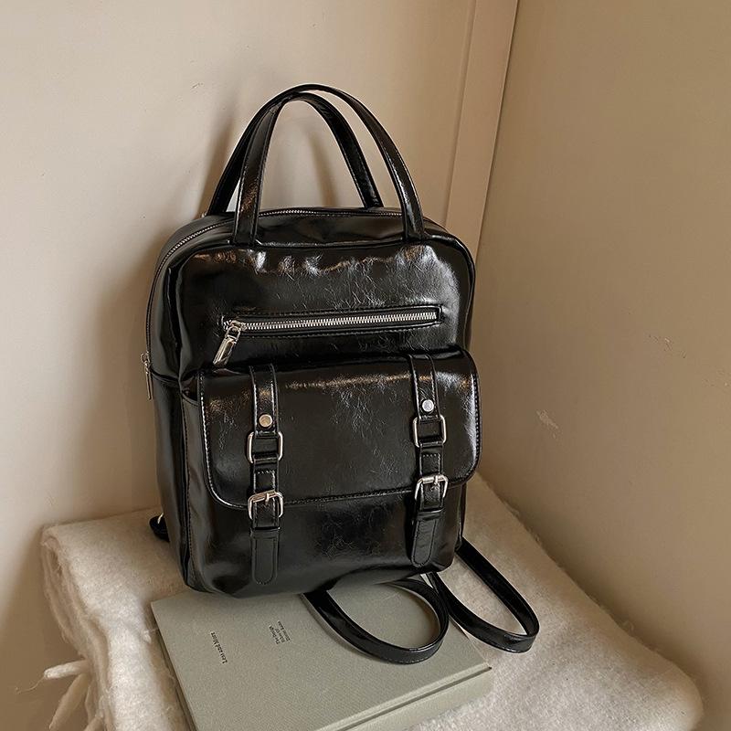 

New oilskin retro large-capacity women s backpack, backpack after autumn and winter, student class schoolbag чёрный