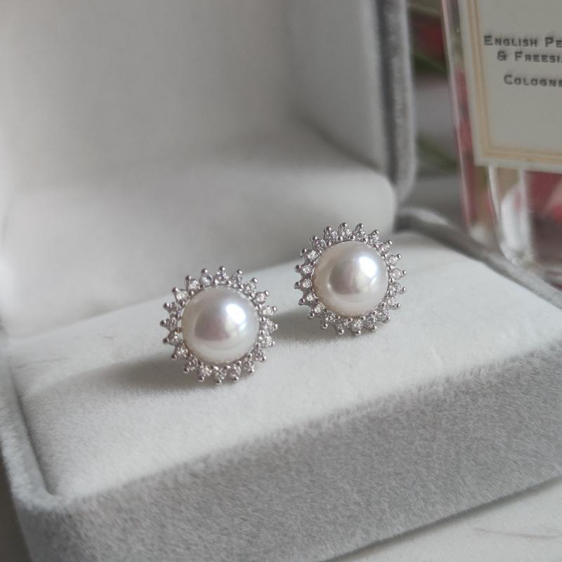 Silver needle sunflower pearl stud earrings women's high-end sense light luxury niche earrings new trendy popular earrings