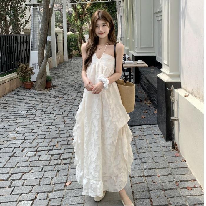 French temperament neck dress women's 2026 early spring new seaside vacation wind backless A-word long dress fairy dress