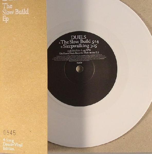

7inch Record DUELS - The Slow Build Ep NUD7S66 Nude Records 2006 UK Rock Used