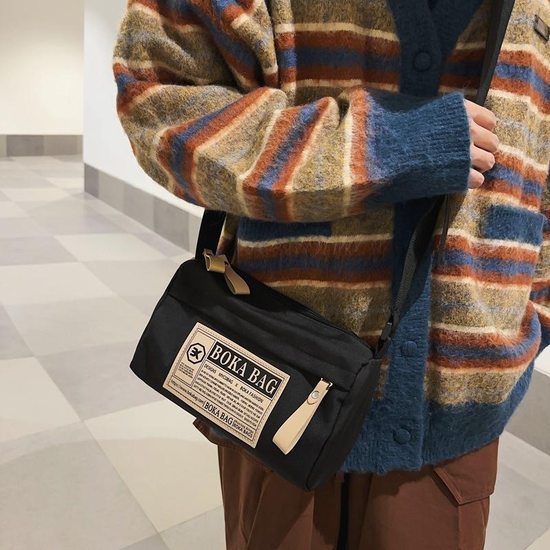 

Japanese ins wind small satchel men s trendy brand niche design sense bag women s, simple and versatile messenger bag small square bag