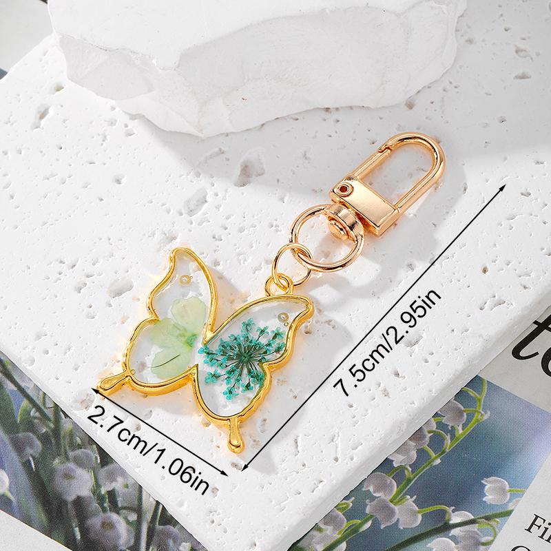 

1 шт. Брелок-подвеска в виде бабочки и рыбьего хвоста из цветной смолы, с металлическим покрытием, держатель для ключей, креативный, неправильной формы, с засушенными цветами, в виде капли воды