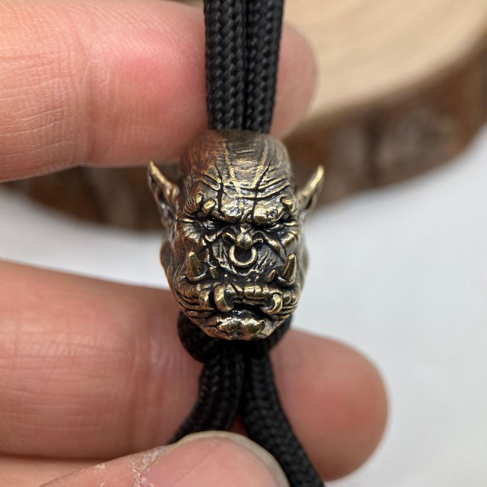 

1 шт. Статуэтка головы орка Адский рев Латунная бусина-нож EDC Аксессуары для улицы DIY Плетеный шнурок Подвеска Ювелирные изделия Панк Браслет Шармы