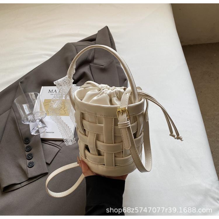 2025 Spring and Summer New Woven Niche Hand Basket Fashionable Versatile Single Shoulder Crossbody Premium Sense Commuter Bucket Bag
