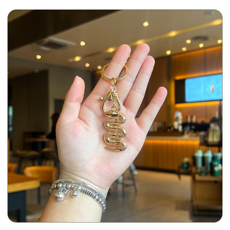 

IGNICASE New Creative Keychain Pendant Super Fire Exquisite Men s and Women s Couples Bag Pendant Hand Rope Luggage Accessories