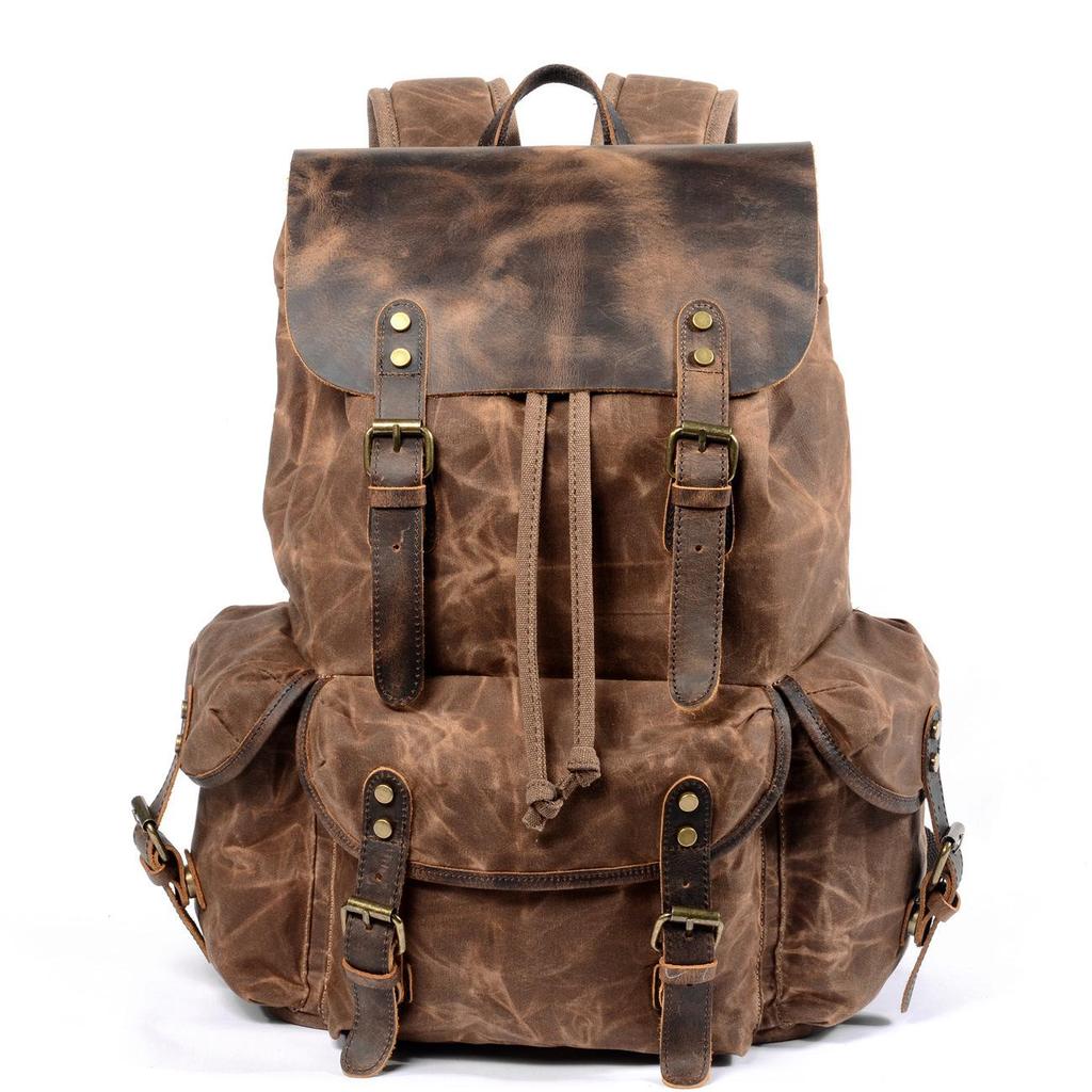 Retro Waxed Canvas Backpack - Men's Trendy Large-Capacity Shoulder Bag for Travel and Student Use.