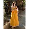 Beach vacation wind yellow fringed suspender dress women's summer 2026 new temperament loose A-shaped long skirt