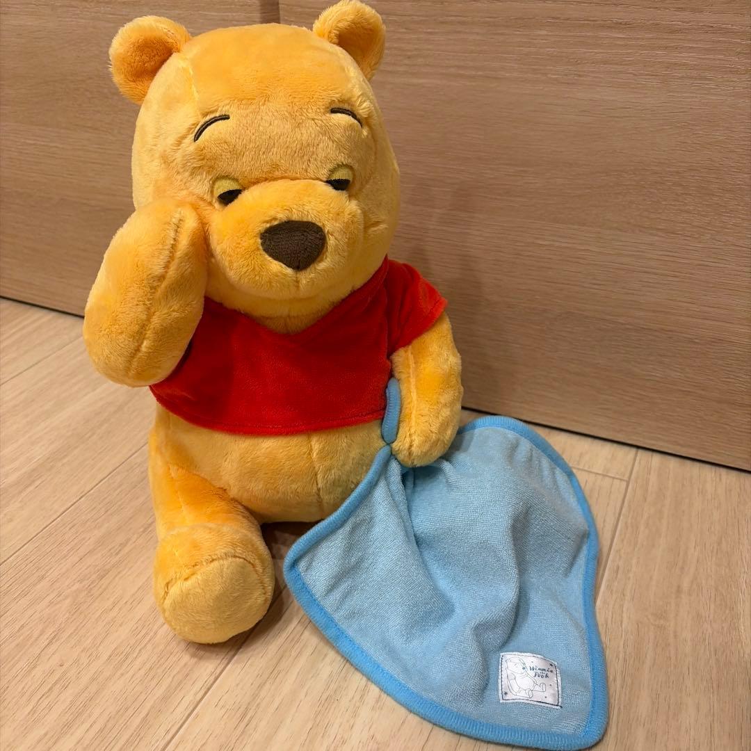 Winnie the Pooh sleeping stuffed toy