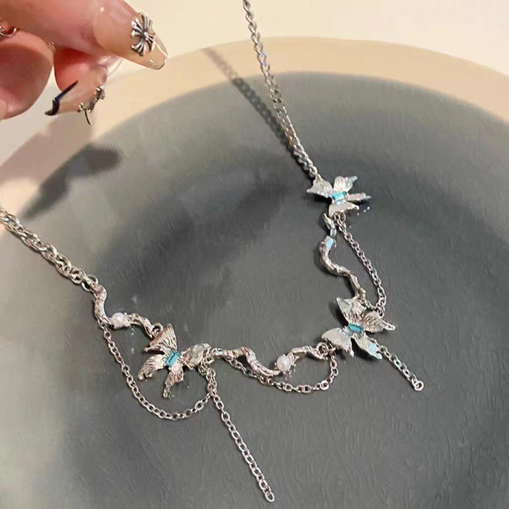 Lake blue liquid butterfly necklace, light luxury, niche design, high-end design, sweater chain, new women's collarbone chain