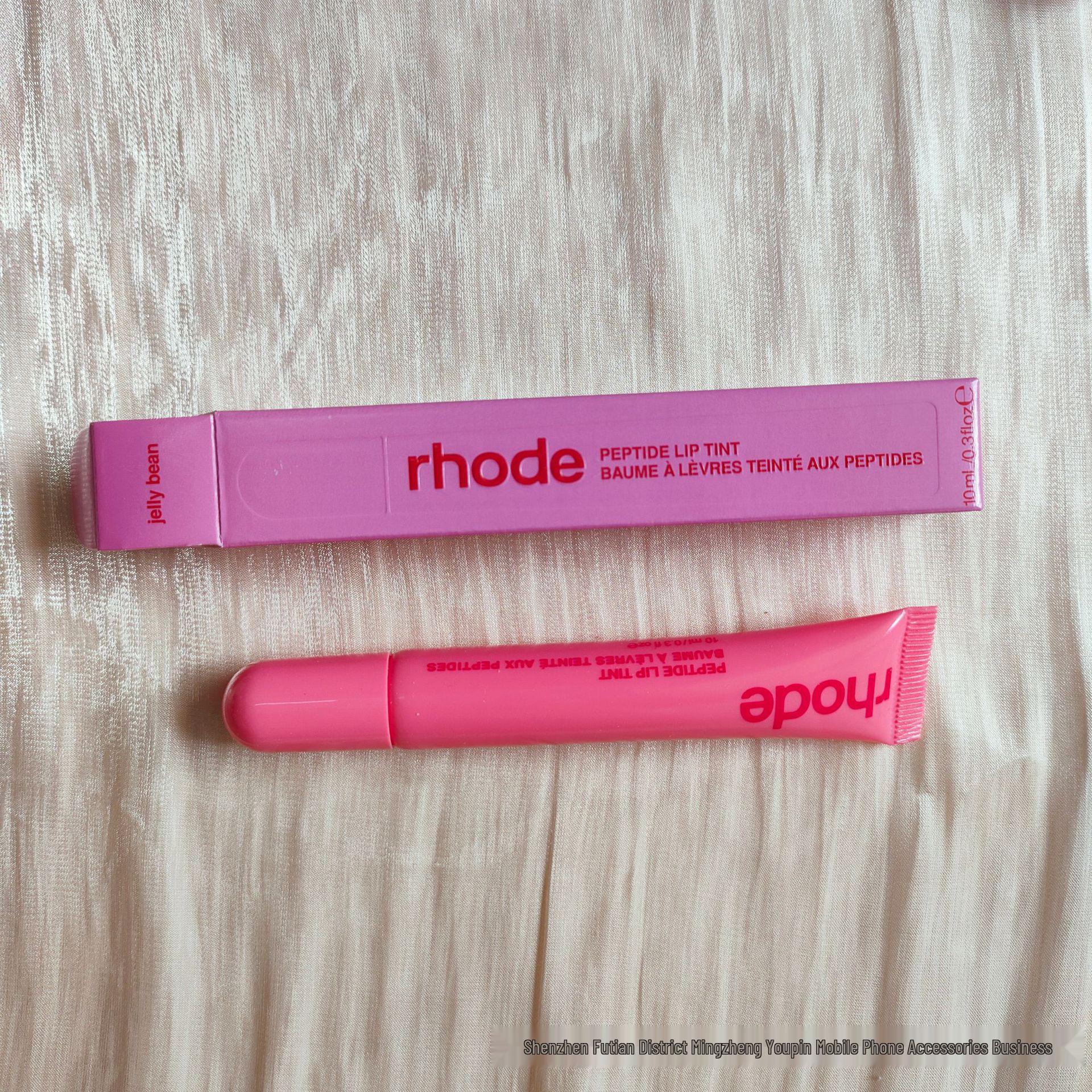 

Rhode Skin от Хейли Персиковый/Гуавовый Желейный Бальзам для Губ - Увлажняющий и Питательный Мягкий Уход за Губами, Новое Цветовое Издание в Чехле для Телефона.