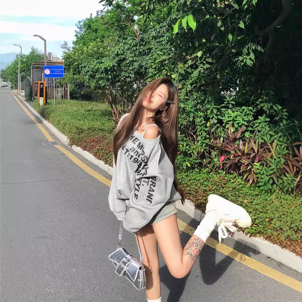 American-Style Oversized Off-Shoulder Sweater: Letter Print, Long Sleeve, Casual Loose Fit for Women In Early Autumn.