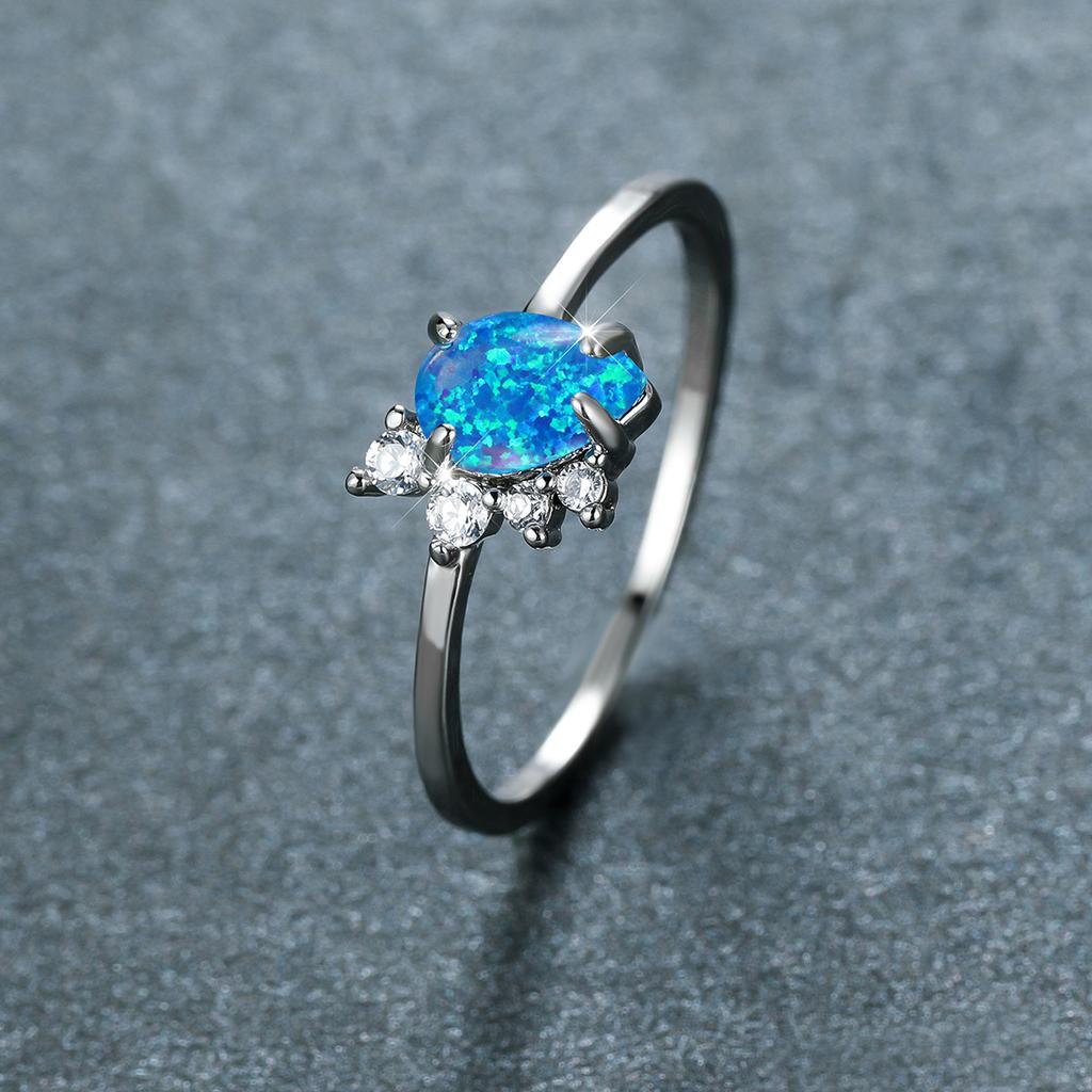 Four Claw Water Droplet Blue Border White Diamond Ring for Women Simple and Personalized Ring