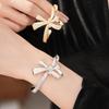 Ningguang Gold-Plated Zirconia Bow Cuff Bracelet: Luxury European-American Fashion Accessory