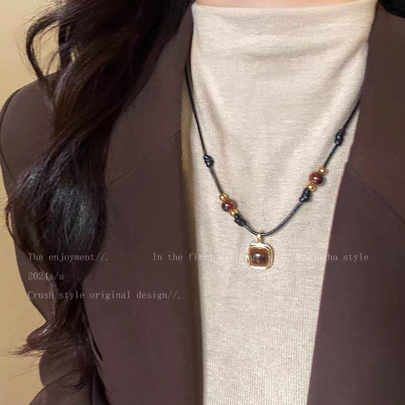 

Tiger S Eye Stone Pendant, Leather Rope Necklace, Women S Medieval Light Luxury, High-End Decorative Sweater Chain, Retro Versatile Accessories