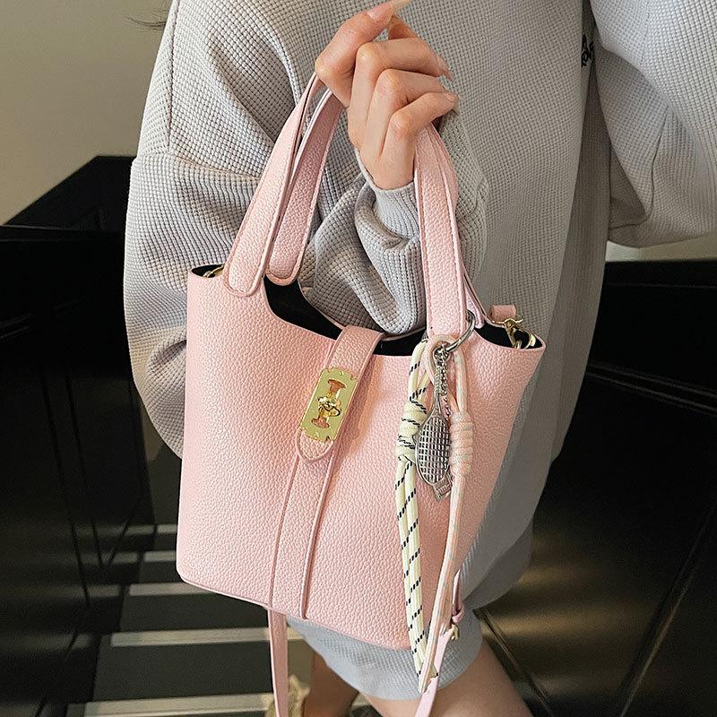 This Year's Popular Simple Ou Ruofeng Lychee Pattern Hand Carrying Bucket Bag Fashion Temperament Versatile High Sense Messenger Women's Bag