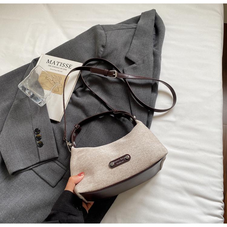

Niche casual canvas handbag 2025 new fashion women commuter messenger bag crescent bag simple shoulder bag