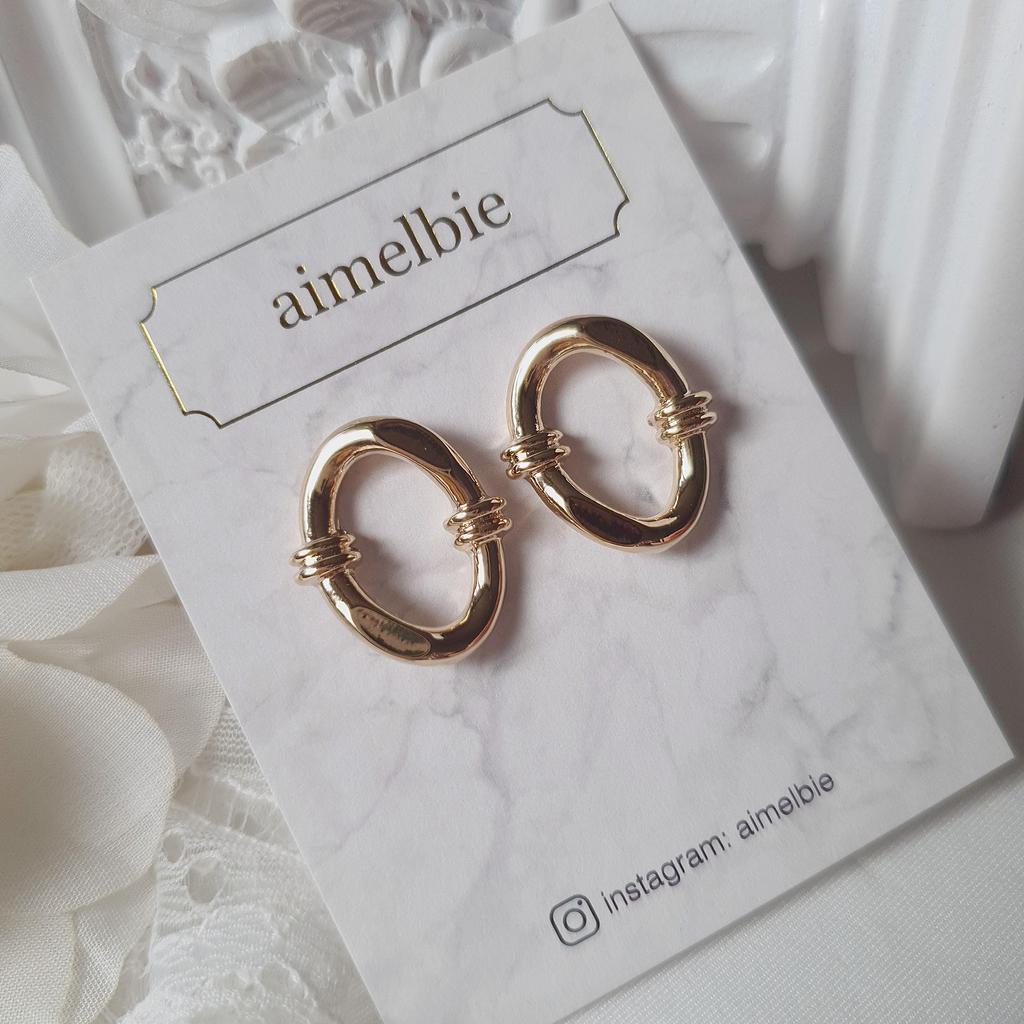 Geknotete ovale Ringohrringe - Goldfarben