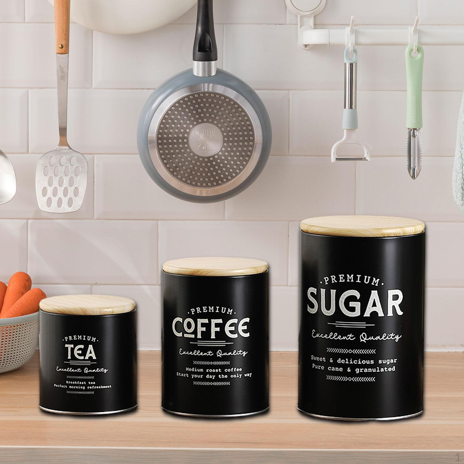 

Композиция из 3 банок для хранения кофе, чая и сахара на кухонной столешнице чёрный