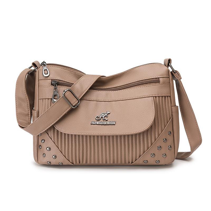 Einfarbige Damen Crossbody-Tasche mit geripptem Panel und Nieten-Details Elegante Kunstleder-Umhängetasche für den täglichen Gebrauch