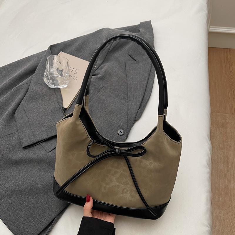 Korean version of niche foreign style portable bucket bag women's 2025 autumn new high-value suede bow shoulder bag