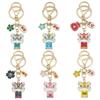 Six-Color Oil Drip Cartoon Chinese Style Keychain: Four-Leaf Clover, Cherry Blossom, Lion Pendant for Backpack