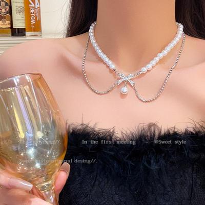 Elegante Colar de Pérolas com Laço Duplo: Acessório Clavicular Chic, Versátil, Tendência