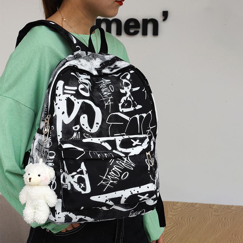 Nouveau Sac à Dos Scolaire Couple Lettres Graffiti Mode Loisirs Voyage Multifonctionnel