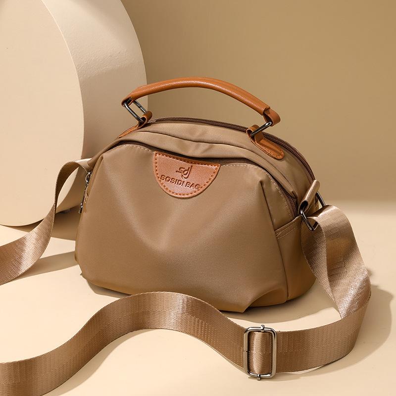 Simple, lightweight and casual multi-layer large-capacity shoulder messenger bag.