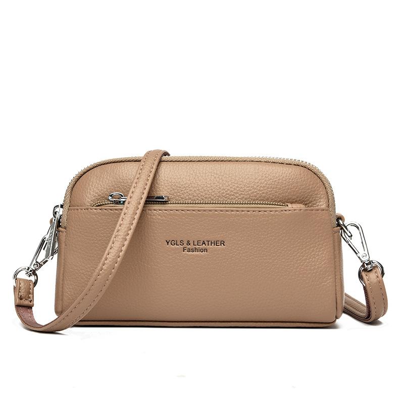 Hand-held small shell bag trendy girl portable hand-held change bag double-layer leather single shoulder oblique span women's bag