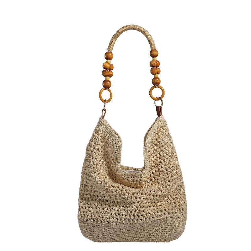 Lässige Baumwollfaden-Flechtbeutel mit großem Fassungsvermögen, neue hohle handgewebte Schultertasche, Urlaubs-Strandtasche, vielseitige Damentasche