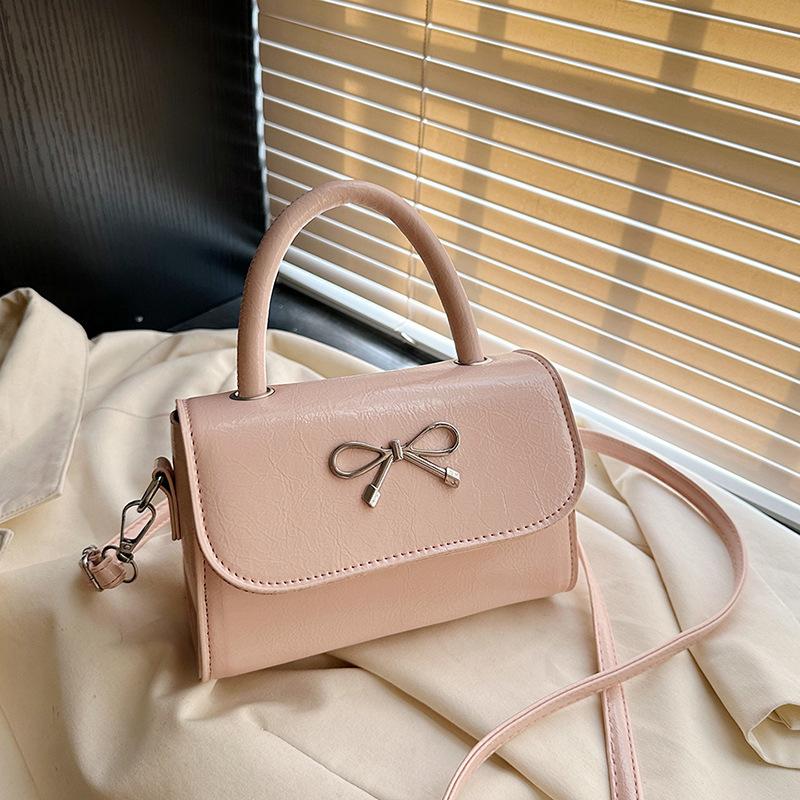 2025 simple solid color bow sewing line less fashionable casual oblique span single shoulder portable small square women's bag