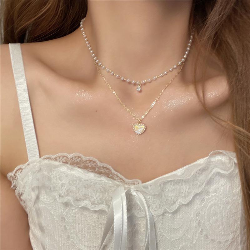 Zweilagige Halskette mit Perlenliebe, neuer Sinn für Nischendesign, schlichtes und vielseitiges modisches Schlüsselbeinketten-Accessoire