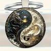 Yin Yang Dragon Keychain - Sleek Alloy Pendant with Intricate White and Red Dragon Design, Perfect Accessory.