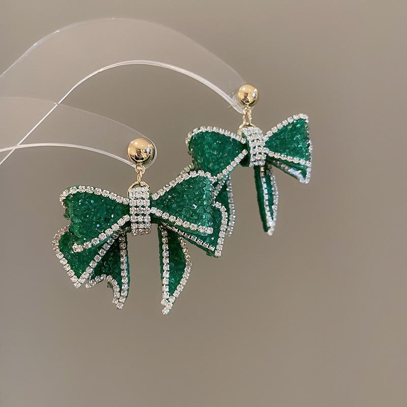 Boucles d'oreilles bohèmes roses à fleurs de perles de rocaille et pompons de perles