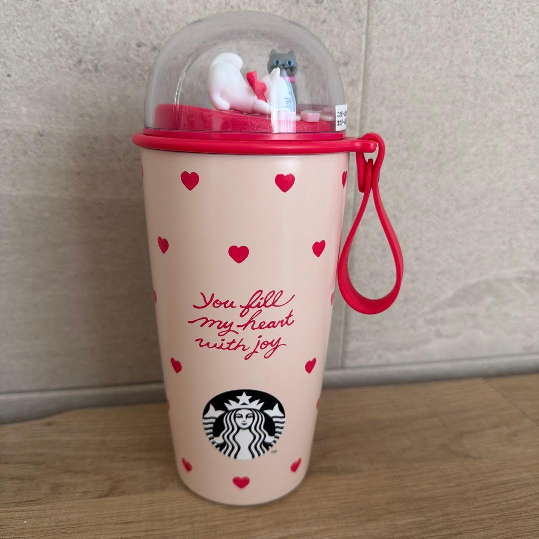 Starbucks heart pattern tumbler cat figure included.