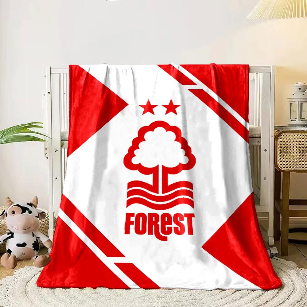 A red tree and wave logo with two stars, framed by geometric red shapes. for all seasons blanket lunch break throw gift